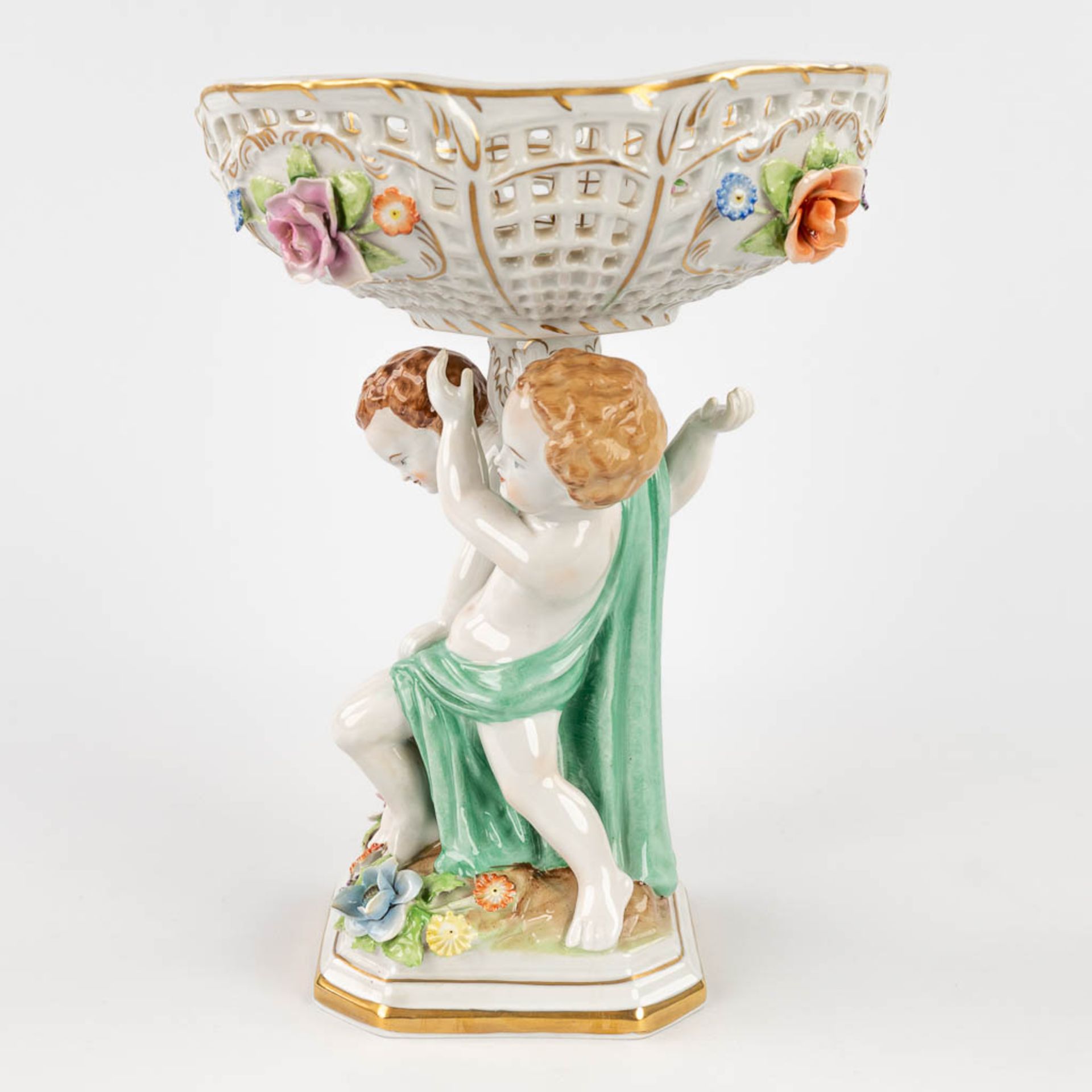 Plaue Schierholz 1817, a porcelain tazza decorated with boys holding up a basket. 20th C. (L: 19 x W - Image 4 of 22