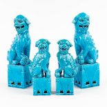 A collection of 2 pairs of Foo dogs, made of blue glazed ceramics. 20th C. (L: 8 x W: 11 x H: 30 cm)