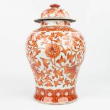 A Chinese vase made of porcelain and decorated with red floral decor. (H: 39 x D: 27 cm)