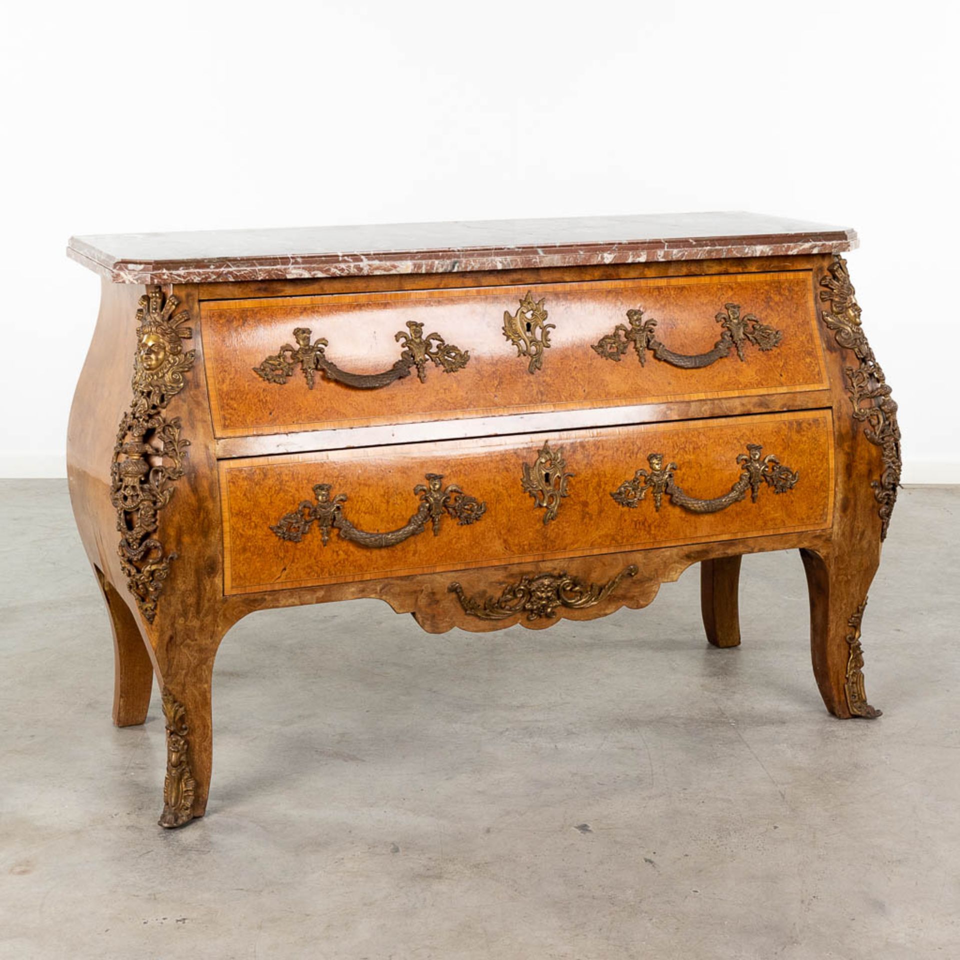 A two-drawer commode mounted with bronze and a marble top. 20th C. (L: 55 x W: 132 x H: 88 cm)