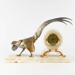 A mantle clock in art deco style with a pheasant, onyx and spelter. The first half of the 20th centu