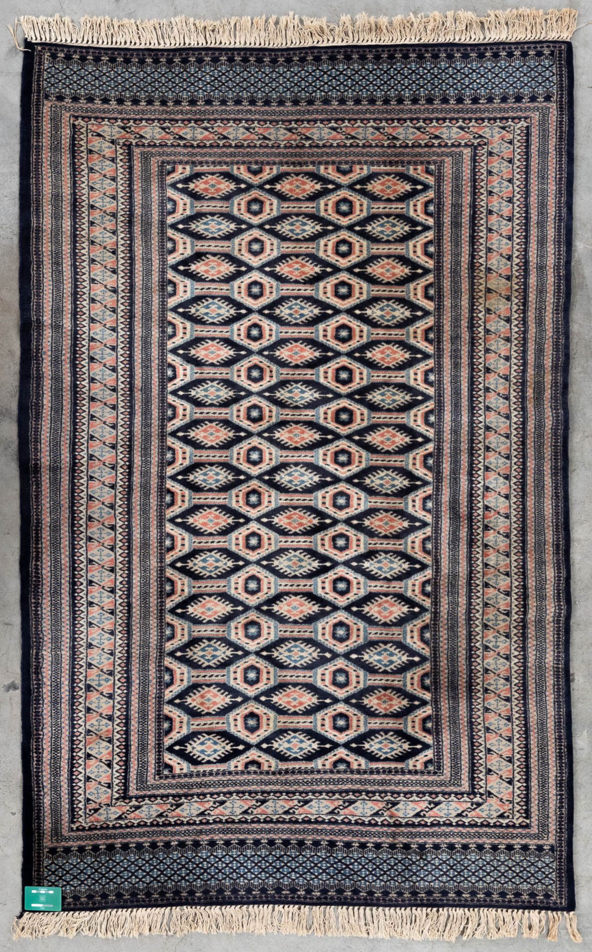 An Oriental hand-made carpet Buchara/Bokhara. (199 x 126 cm). (L: 199 x W: 126 cm) - Image 2 of 10
