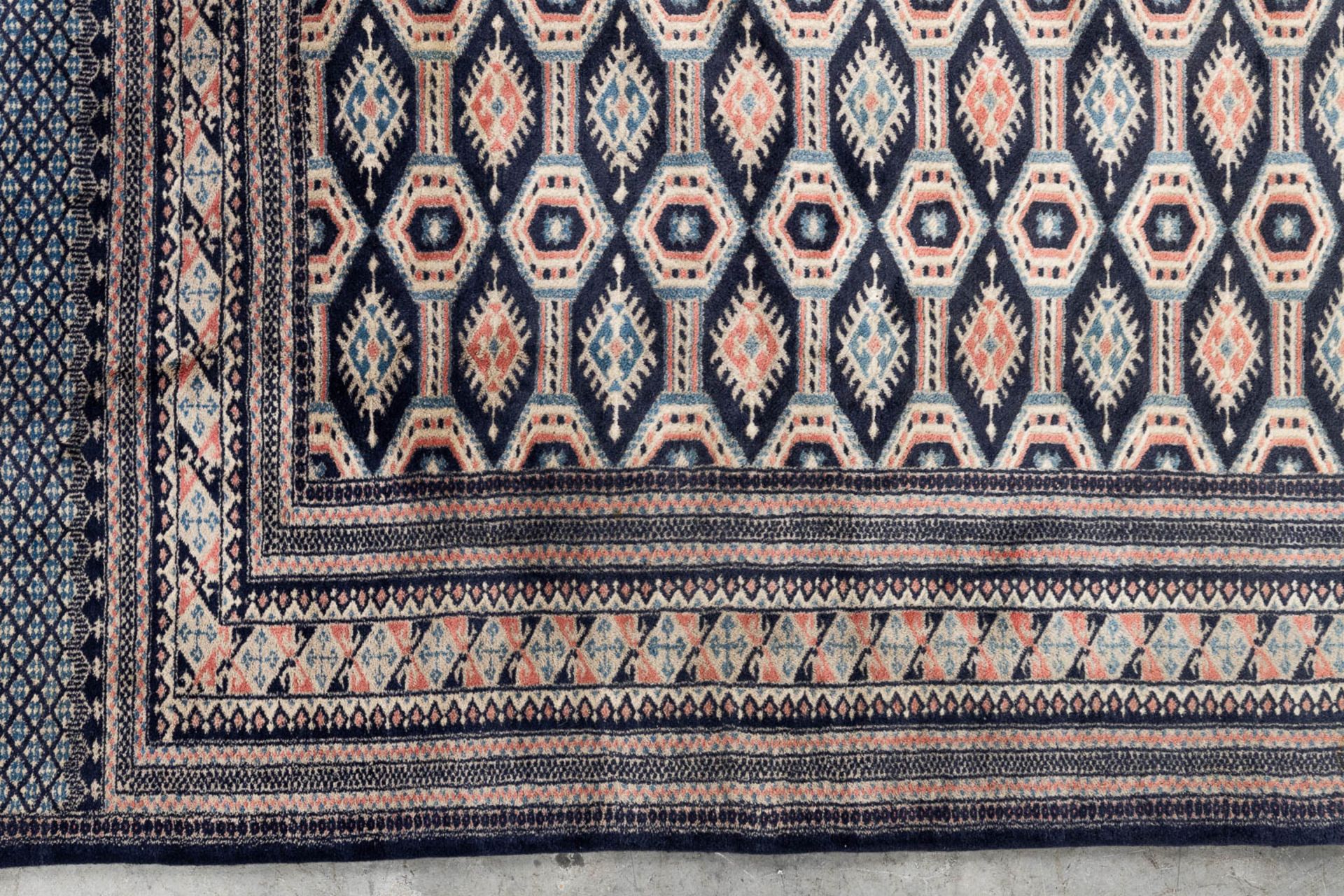 An Oriental hand-made carpet Buchara/Bokhara. (199 x 126 cm). (L: 199 x W: 126 cm) - Image 5 of 10