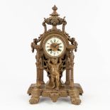 A bronze mantle clock, decorated with putti. Circa 1900. (L: 16 x W: 30 x H: 48 cm)