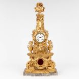 A wood sculptured clock in the shape of an obelisk. 20th century. (W: 33 x H: 68 cm)