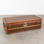 Louis Vuitton, an antique traveller's suitcase, fabric over wood and leather. (L: 57 x W: 111 x H: 3