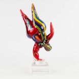 A glass figurine, in the style of Niki The Saint Phalle, probably made in Murano, Italy. (W: 13 x H:
