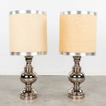 A pair of silver-plated ceramic table lamps with original lampshades. Circa 1970. (H: 91 x D: 20 cm)