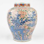 A Chinese vase with underglaze blue and overglaze red decor. (H: 31 x D: 24 cm)