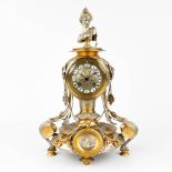 A mantle clock made of bronze in Louis XVI style. Circa 1900. (L: 23 x W: 29 x H: 42 cm)