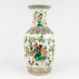 A Chinese famille rose vase decorated with roosters and flowers. 19th/20th C. (H: 45 x D: 21 cm)
