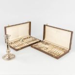 A pair of ecrains with dessert cutlery, silver, 833. Added a candlestick made of silver, 833. 547g.