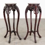 A pair of Chinese hardwood tables with a marble top. (H: 91 x D: 43 cm)