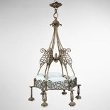 A chandelier made of wrought iron in art deco style. (H: 103 x D: 63 cm)