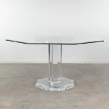 An octagonal, glass and acrylic dining room table, circa 1980-1990. (L: 140 x W: 140 x H: 75 cm)