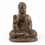 An Oriental Buddha made of bronze. 19th C. (L: 13 x W: 16 x H: 23,5 cm)