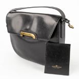 Delvaux, a cross-body handbag made of black leather. (W: 23 x H: 19 cm)