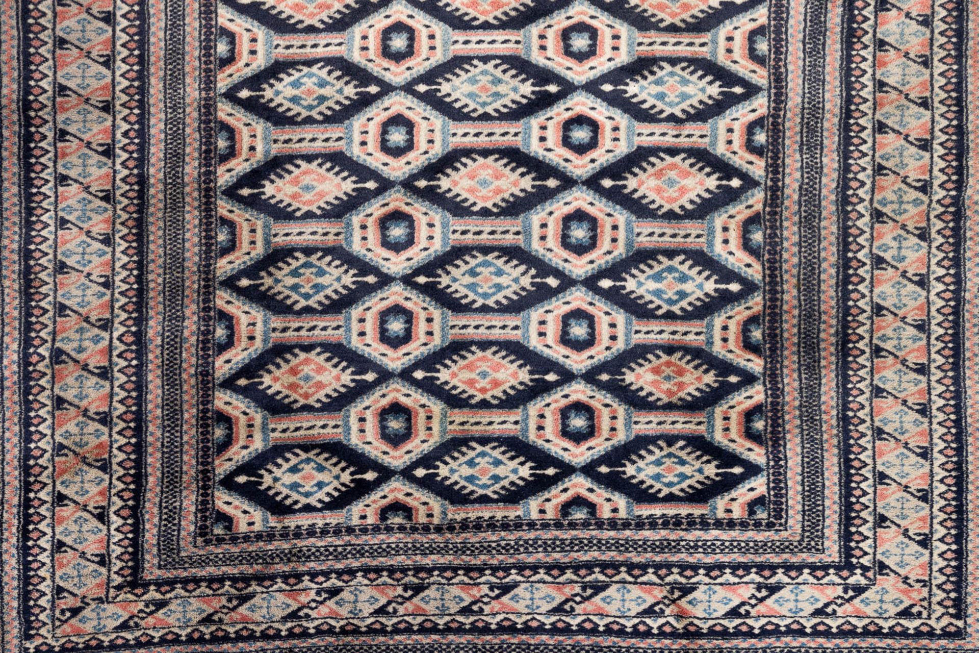 An Oriental hand-made carpet Buchara/Bokhara. (199 x 126 cm). (L: 199 x W: 126 cm) - Image 4 of 10