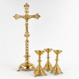 An antique bronze crucifix and 3 matching candelabra, standing on claw feet. 19th C. (W: 28 x H: 68