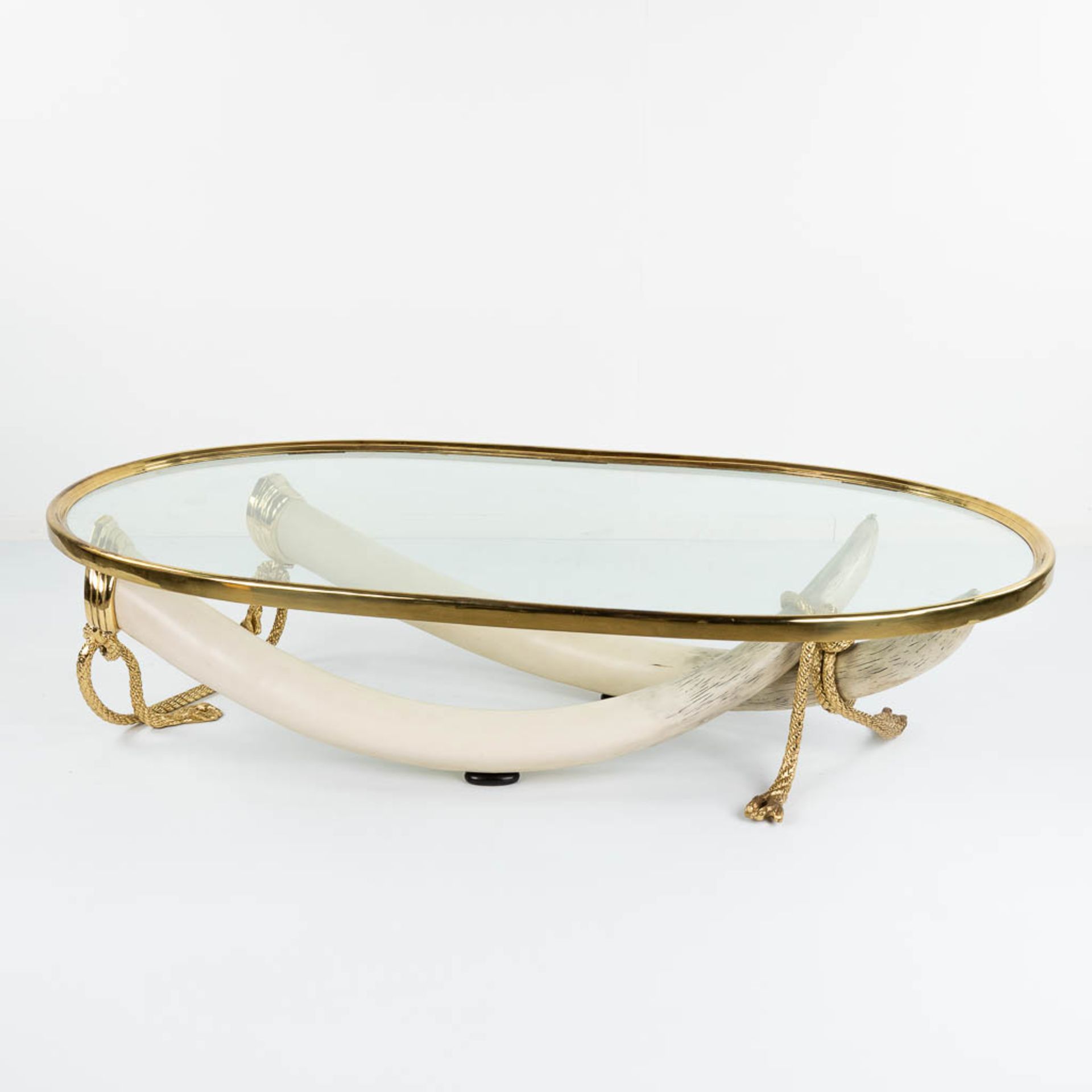 Valenti ' COLMILLOS', a coffee table with elephant tusks and glass in Hollywood Regency style. (L: 1