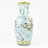 A Chinese vase made of porcelain and decorated with Dragons. Marked Yong Qing Chang Chun. (H: 43 x D