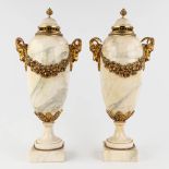 A pair of white marble cassolettes mounted with gilt bronze in Louis XVI style. 19th C. (W: 24 x H:
