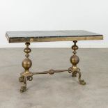 A mid-century coffee table made of bronze with a green marble top, decorated with mythological figur