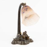 Schneider, a table lamp with a pate de verre shade, decorated with a jester. Spelter. (L: 17 x W: 17