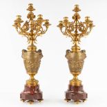 A large pair of candelabra, red marble with gilt bronze, decorated with playing children, satyr figu