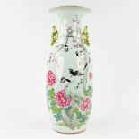 A Famille Rose Chinese vase decorated with birds and branches. 19th/20th C. (H: 60 x D: 23 cm)