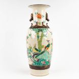 A Chinese vase, Nanking Stoneware, decorated with Phoenixes and floral decors. (H: 62 x D: 23 cm)