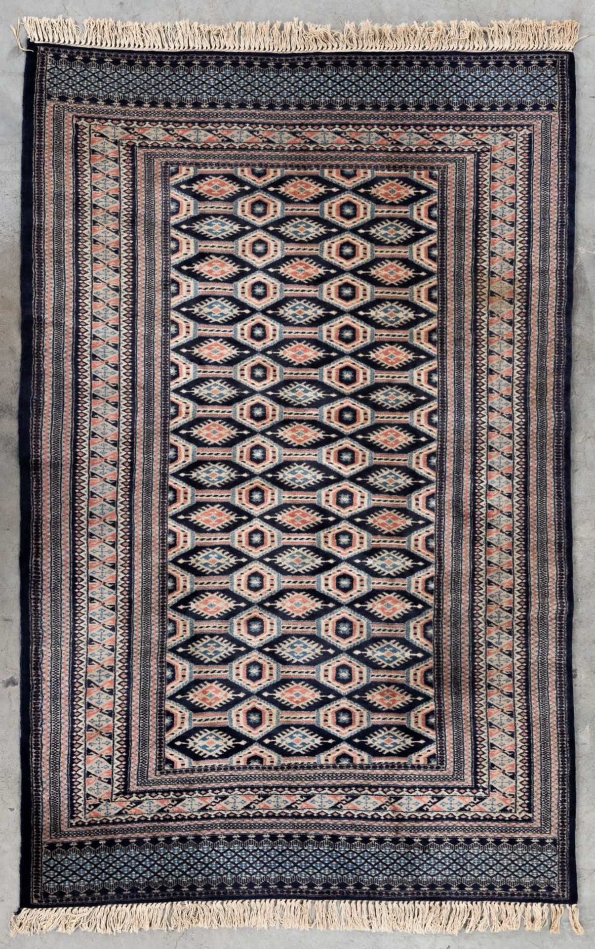 An Oriental hand-made carpet Buchara/Bokhara. (199 x 126 cm). (L: 199 x W: 126 cm)