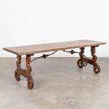 A coffee table, made of walnut in Spanish style. (L: 157 x W: 52 x H: 52 cm)