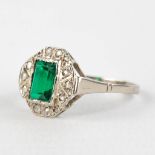 An antique ring with green (semi-)precious stone in a white gold ring. 14 karat.