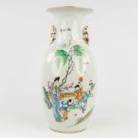 A Chinese vase decorated with playing children and ladies. 19th/20th century. (H: 44 x D: 20 cm)