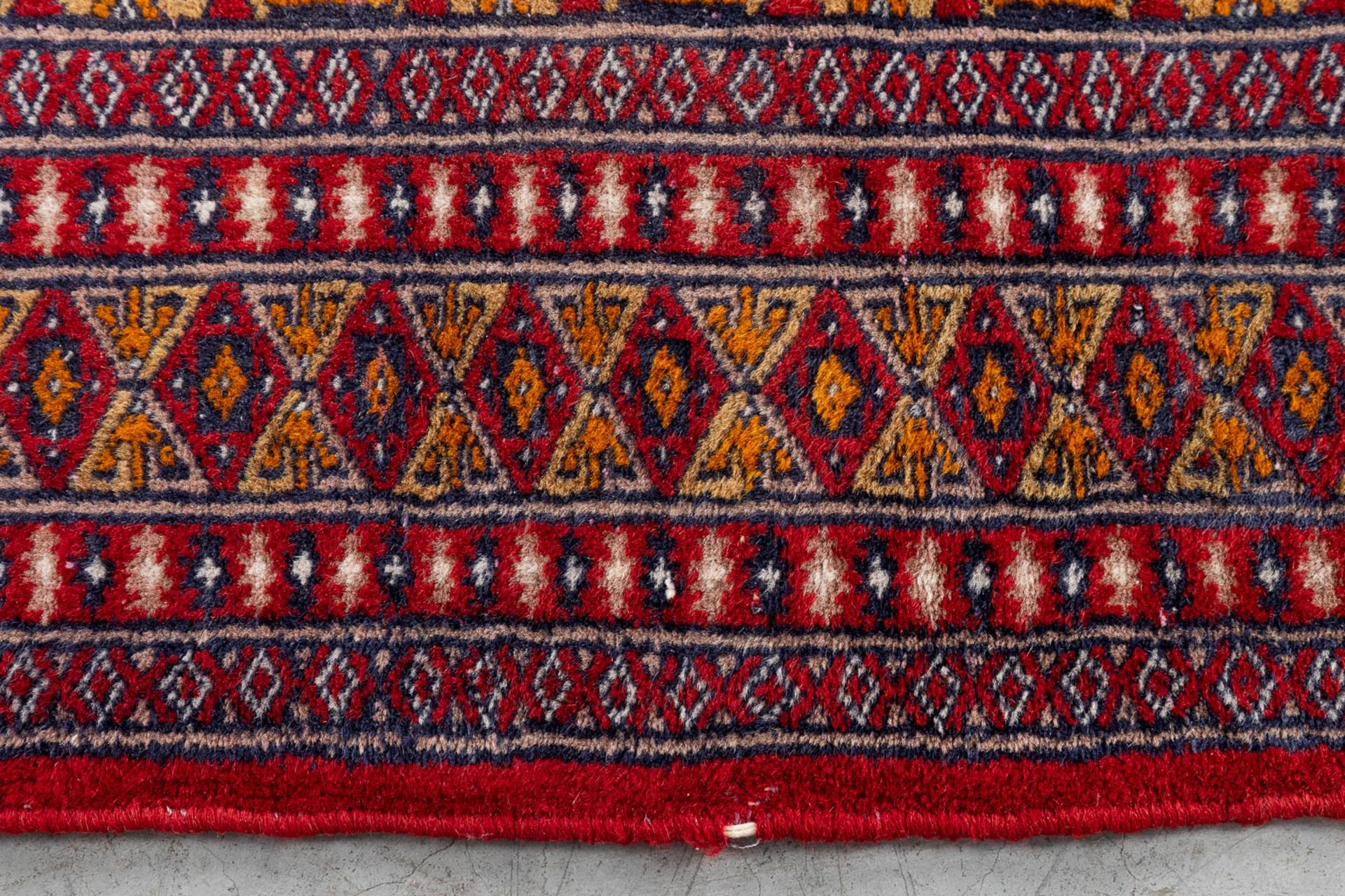 A set of 2 Oriental hand-made carpets, Bokhara/Buchara. (125 x 87 cm)(124 x 170 cm). (L: 124 x W: 17 - Image 9 of 11
