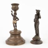 A Jester figurine and candle holder, made of bronze. 19th C. (H: 13,5 x D: 6,5 cm)