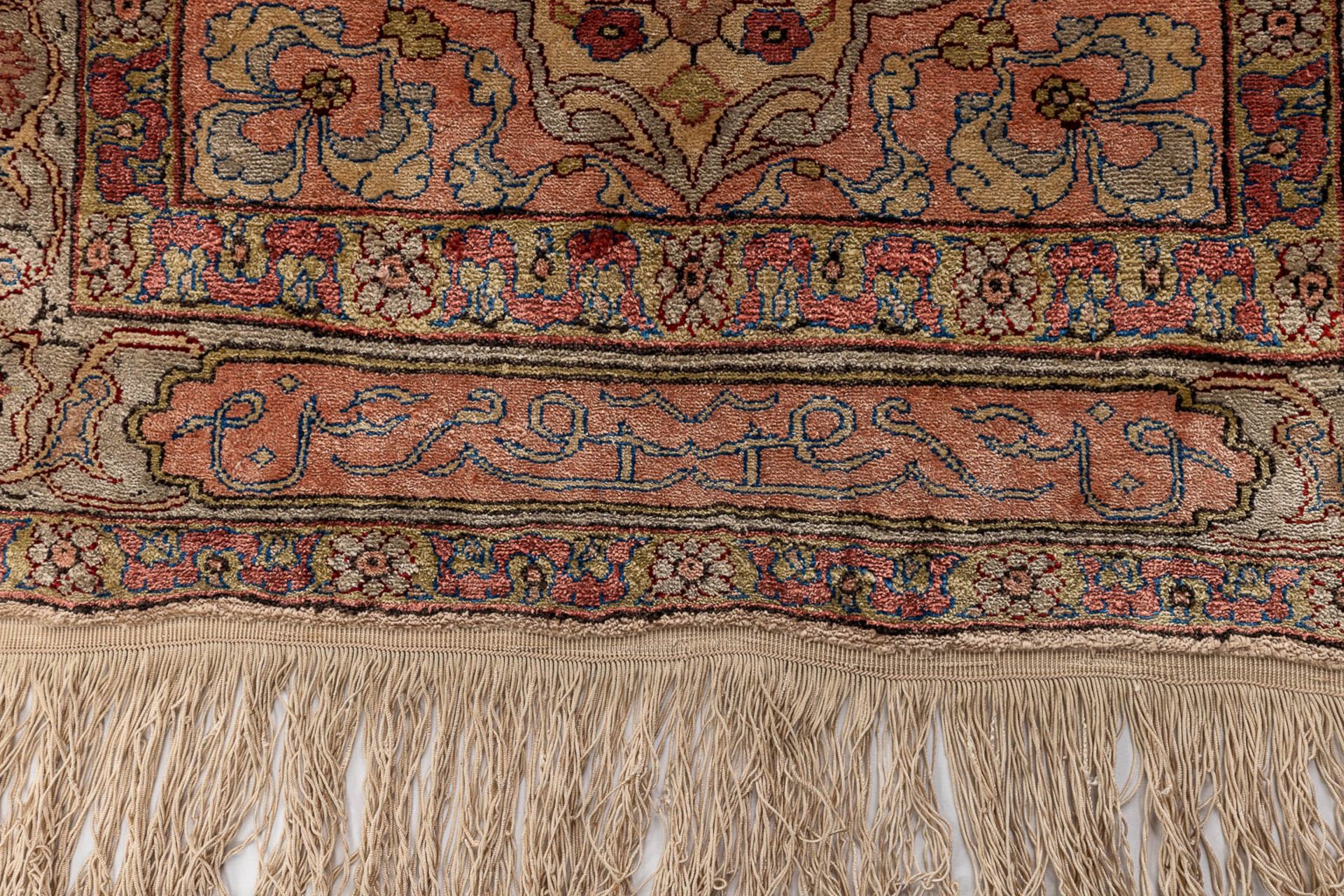 An Oriental hand-made carpet, silk. Hereke. (L: 60 x W: 92 cm) - Image 3 of 7