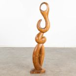 An abstract wood sculpture, marked J.D. 1972. (L: 15 x W: 22 x H: 99 cm)