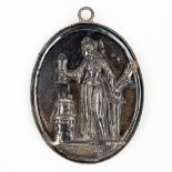 An oval pendant with an image of Saint Barbara. Silver, 18th century. 66g. (W: 6,5 x H: 8 cm)