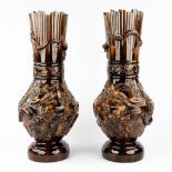 A pair of Chinese stoneware vases, decorated with relief dragons. 19th/20th century. (H: 62 x D: 26