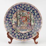 A large Chinese plate 'Famille Rose', decorated with the emperor and floral decors. (H: 7 x D: 45 cm