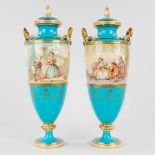A pair of decorative vases with decors of children, sky blue porcelain, probably Svres. (H: 39 cm)
