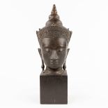 A decorative bust of a buddha. 20th century. (L: 15 cm)