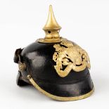 A German 'Pickelhaube' spiked helmet, made of leather and copper, 19th century. (L: 22,5 x W: 19 x H