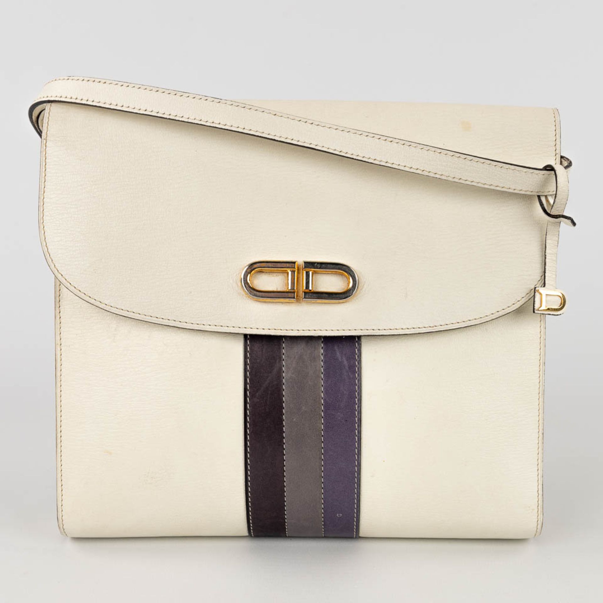 Delvaux, a handbag made of white leather decorated with colored stripes, and gold-plated hardware. ( - Image 4 of 18