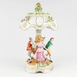 A porcelain table lamp with dancing figurines, marked PMP 1817. (L: 34 x W: 34 x H: 59 cm)