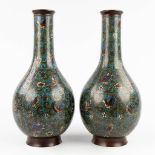 A pair of vases, bronze with champsleve decor. (H: 46 x D: 21 cm)