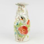 A Chinese vase decorated with lotus flowers and a bird. 19th/20th C. (H: 45 x D: 21 cm)