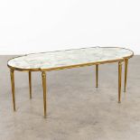 A coffee table, brass with a fume glass top. In the style of Maison Bagus. (L: 46 x W: 110 x H: 40